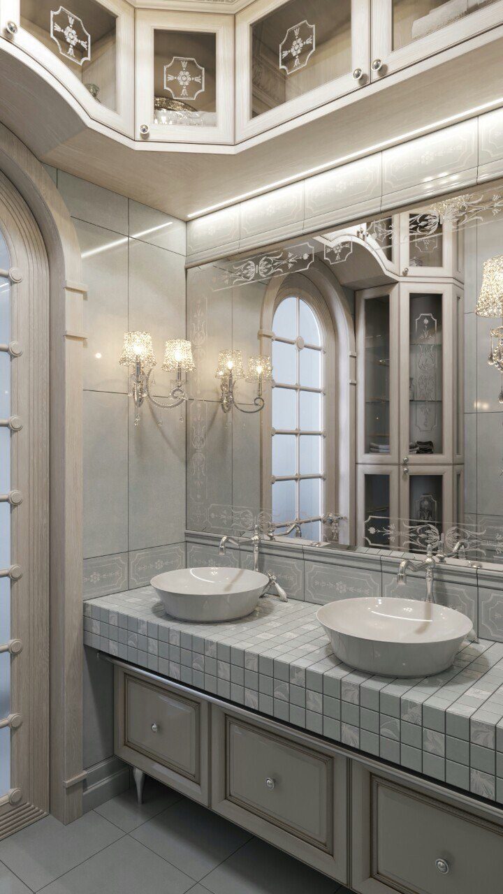 Bathroom with two vessel sinks and an arched window