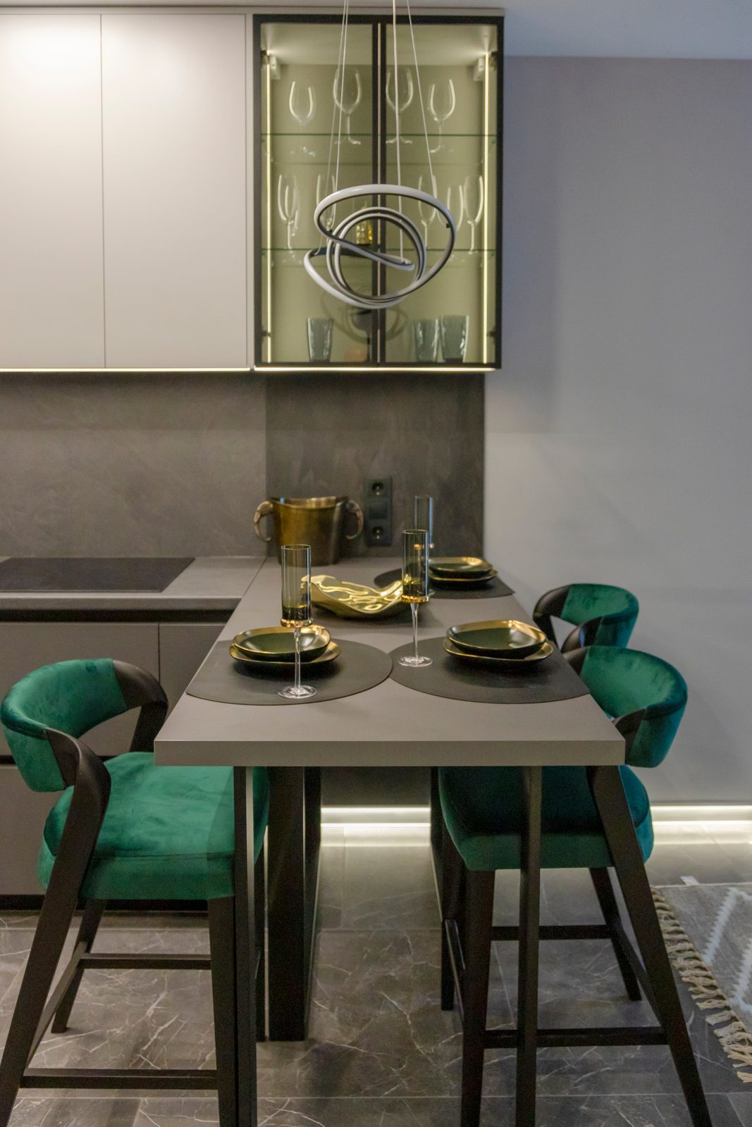Kitchen breakfast bar with green velvet stools