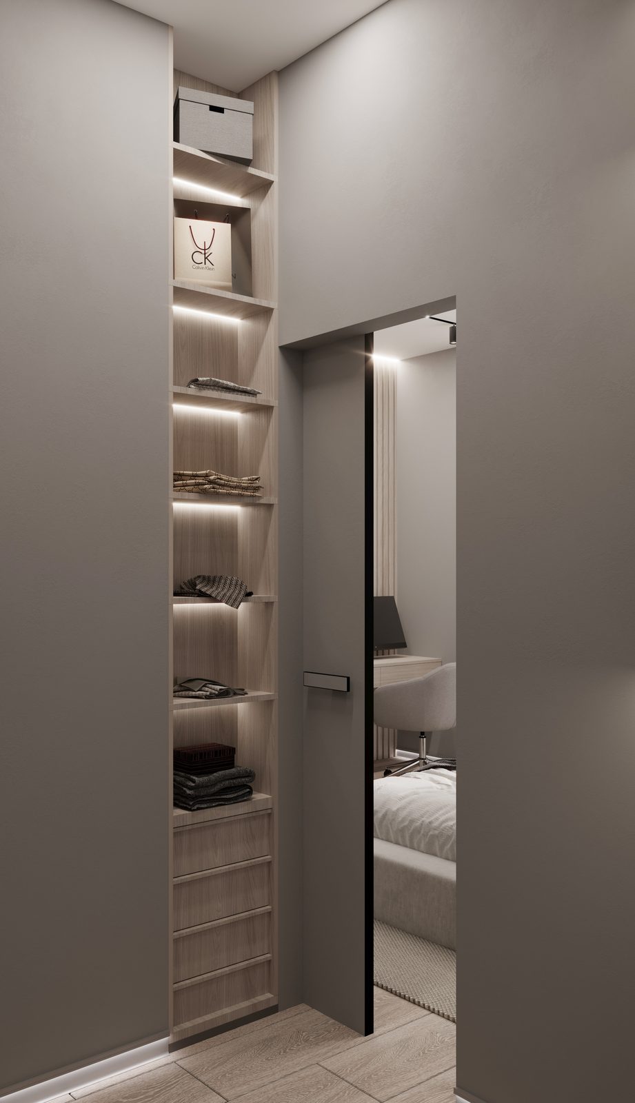 Hallway with built-in shelving and a door to the bedroom